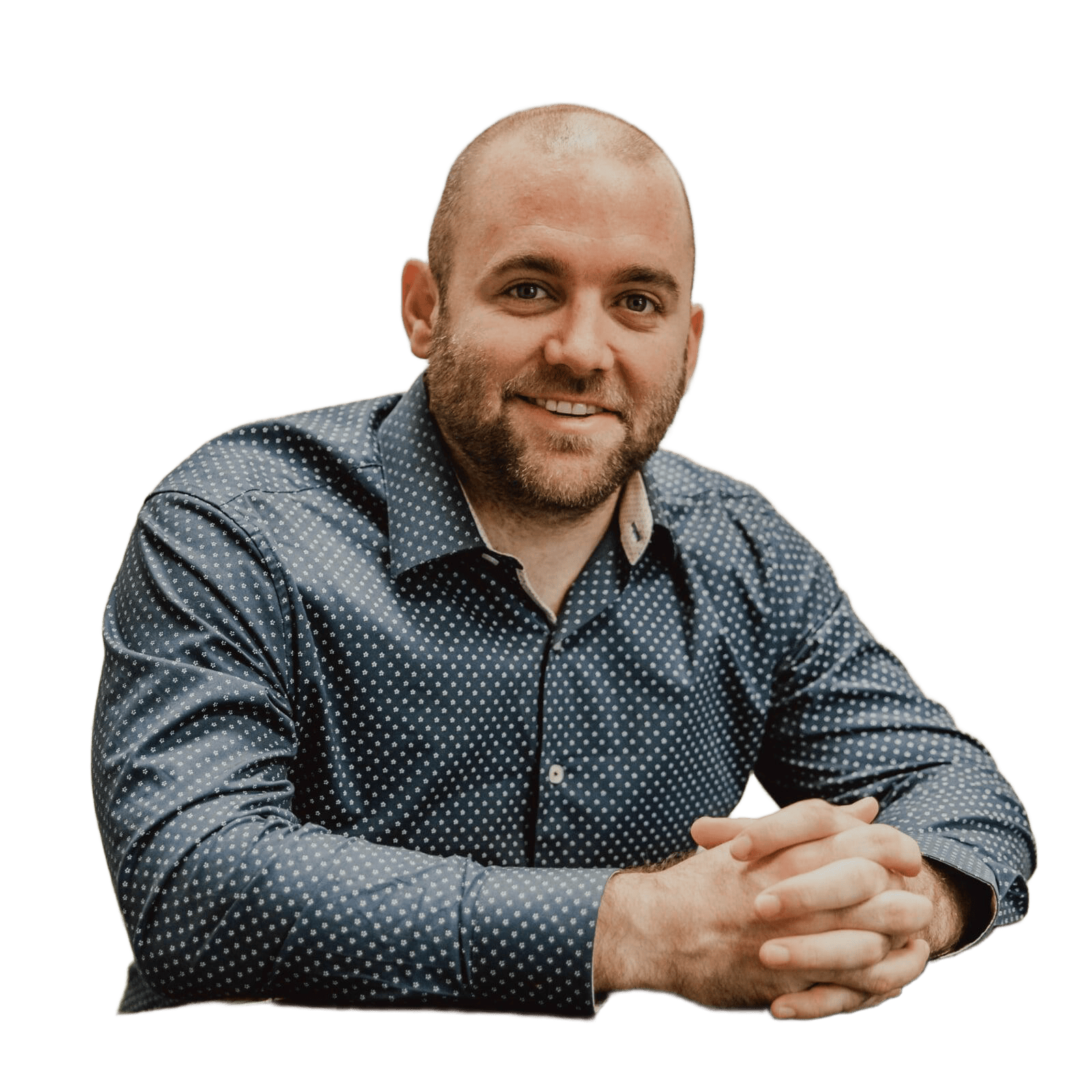 Matthew Clanton, founder, sitting at a table